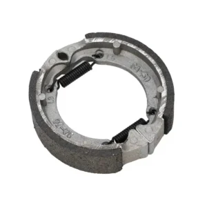 Vista superior de las pastillas de freno para patinete eléctrico Ninebot Max G30, sistema de tambor delantero de 75.5mm, mostrando zapatas con muelles ensamblados y material de fricción semi-metálico.